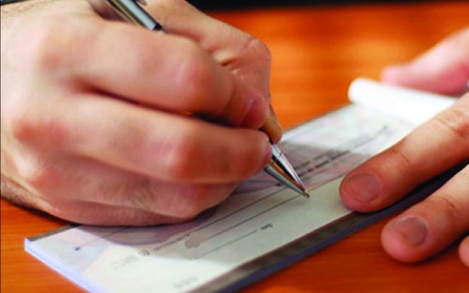 الشيك دون رصيد .. دعوة رئيس الجمهورية إلى العفو الخاص.. ومطالبة البرلمان بإلغاء العقوبة السجنية 